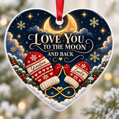 Heart ceramic ornament with golden crescent moon, red mittens, snowflakes and pine, personalized with two names.