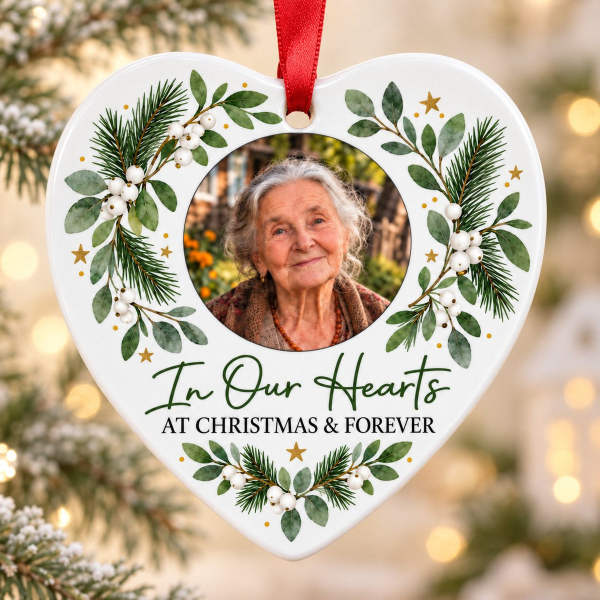 Heart ceramic ornament with In Our Hearts and AT CHRISTMAS & FOREVER around a circular photo frame with green foliage.