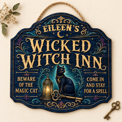 Custom-cut wooden sign with black cat, glowing lantern, golden key, crescent moons, stars, and Wicked Witch Inn text