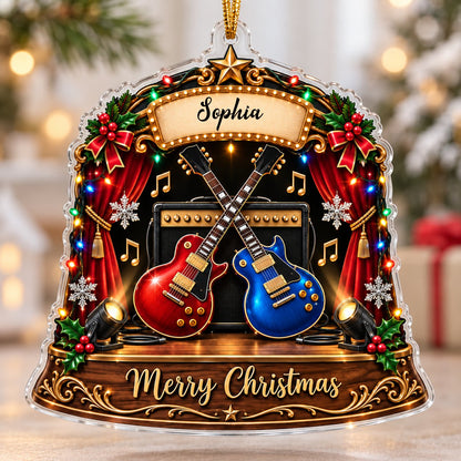 Custom-cut acrylic ornament with crossed red and blue guitars, Merry Christmas marquee, curtains and holly.