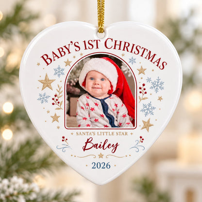 Heart ceramic ornament with arched photo frame, gold stars, blue snowflakes, holly, and 'Baby's 1st Christmas' text.