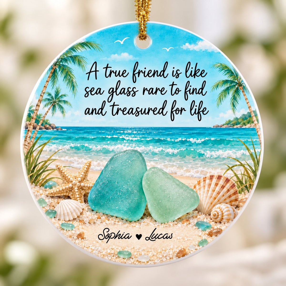 Round ceramic ornament with beach scene, palm trees, sea glass, shells, and a friendship quote with two names.