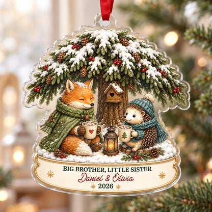 Acrylic ornament with snowy tree, fox and hedgehog holding mugs, banner says BIG BROTHER, LITTLE SISTER.