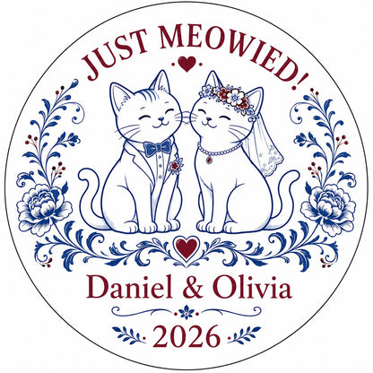 Round ceramic ornament with two wedding cats, 'JUST MEOWIED!', names and year with blue and red folk floral accents