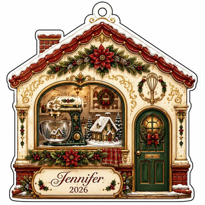 House-shaped acrylic ornament with baking scene, stand mixer, wreaths, and name and year on the bottom banner.