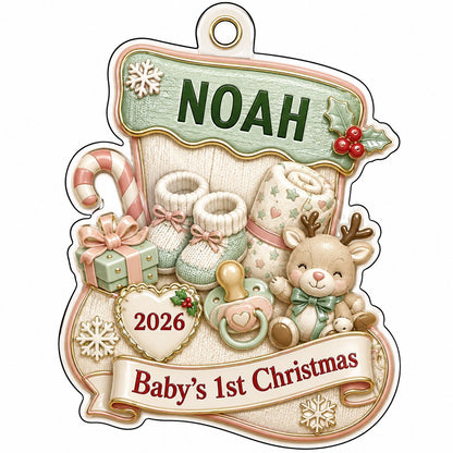 Stocking-shaped acrylic ornament with baby booties, reindeer toy and Baby's 1st Christmas on a cream banner.