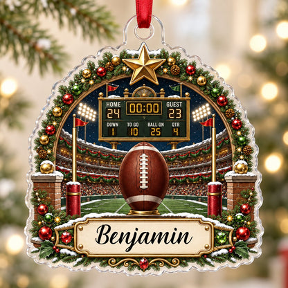 Acrylic ornament with football on a tee, stadium scoreboard, and pine garland border with a name banner.