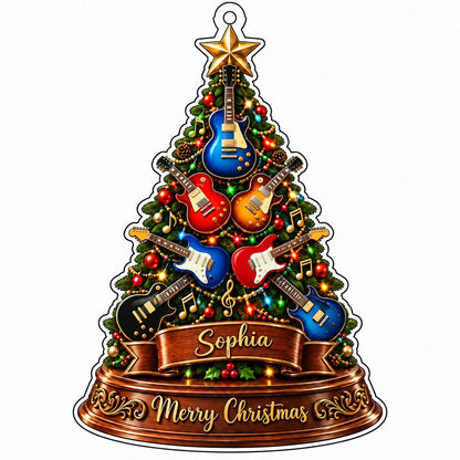Green tree-shaped acrylic ornament with electric guitars, gold music notes, a name banner, and a gold star topper.