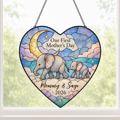 Heart stained-glass suncatcher with mom and baby elephants, crescent moon, pastel clouds, and gold stars.