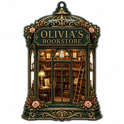 Green and gold ornate acrylic ornament with roses and a cozy bookstore interior reading OLIVIA'S BOOKSTORE.