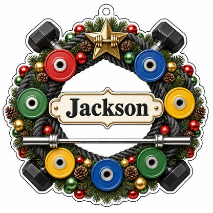 Acrylic ornament shaped around a gym wreath with dumbbells, bumper plates, barbell, and a name banner.