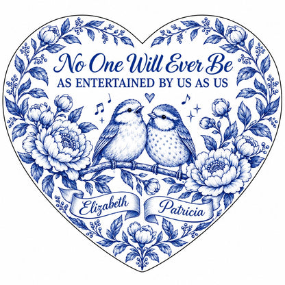Heart ceramic ornament with two birds, blue floral frame, music notes above, and two name banners in cobalt.