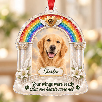 A rainbow arch pet memorial acrylic ornament with a winged golden heart, paw print, lilies, pillars, clouds and a photo 