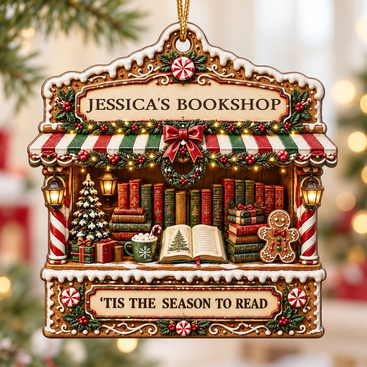 Gingerbread bookstore facade ornament with striped awning, wreath, books, lanterns, and 'TIS THE SEASON TO READ' text.