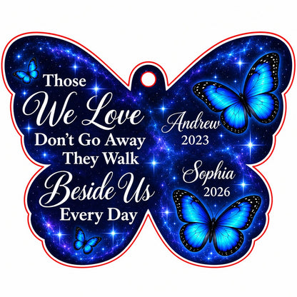 Butterfly-shaped ornament with blue butterflies and a galaxy background, reading Those We Love Don't Go Away.