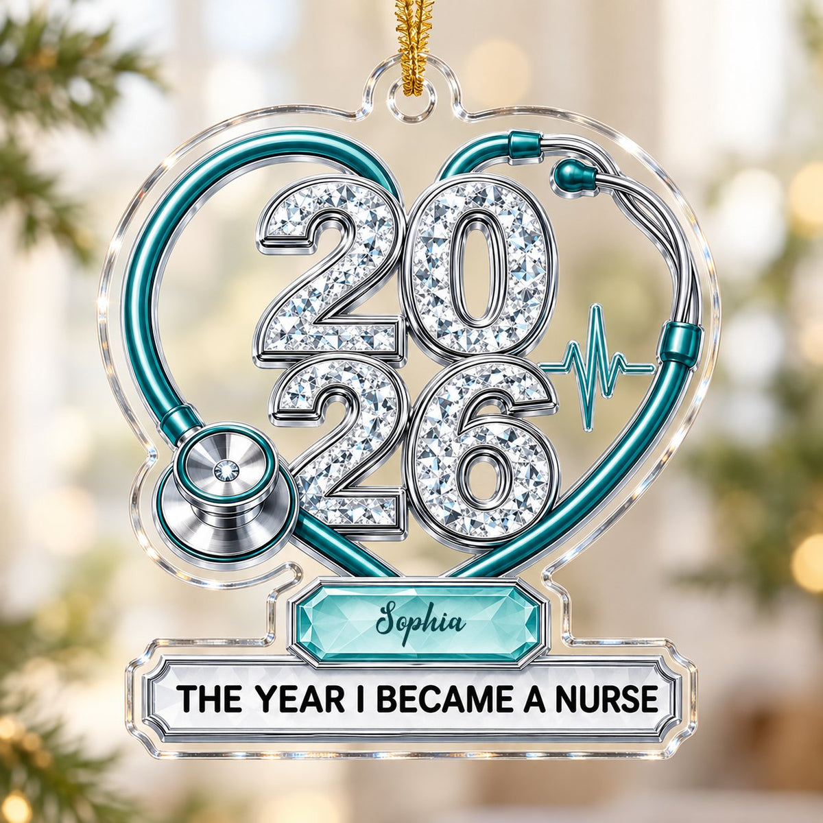 Clear acrylic ornament with a teal stethoscope heart, diamond 2026 numerals, teal ECG wave, and a personalized name bann