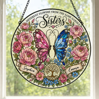 Round suncatcher with pink and blue butterfly, peony wreath, Tree of Life, and Sisters text with two name ribbons.