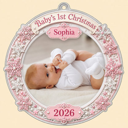 Round acrylic ornament with pink and white snowflakes framing a baby photo and the words Baby's 1st Christmas.