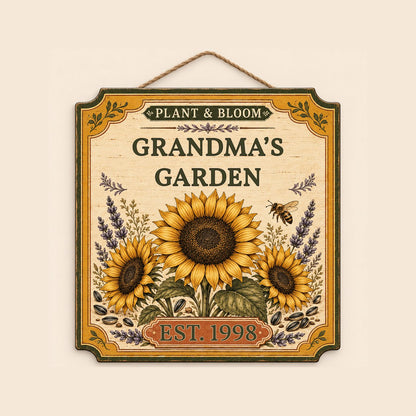 Square bracketed wooden sign with three sunflowers, lavender, a honeybee, and “Plant & Bloom” and “Grandma’s Garden” tex