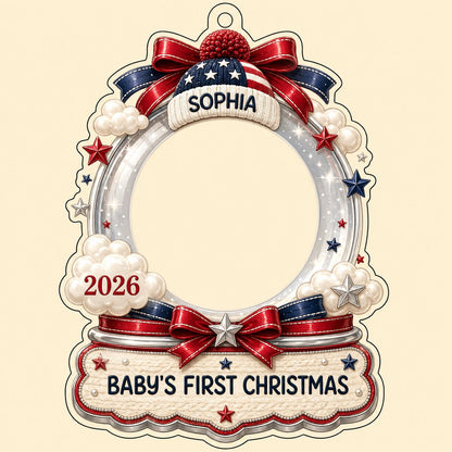 Custom-cut acrylic ornament with baby's photo, patriotic beanie, red bows, stars, and 'Baby's First Christmas' banner.