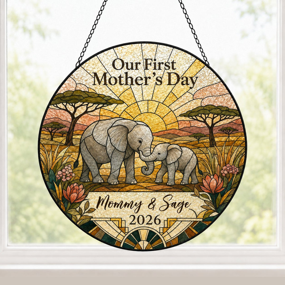Stained glass-style mother and baby elephants at sunrise with 'Our First Mother's Day' text.