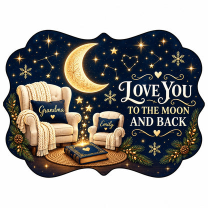 Medallion ceramic ornament with golden moon, stars, two chairs, and 'LOVE YOU TO THE MOON AND BACK' text.