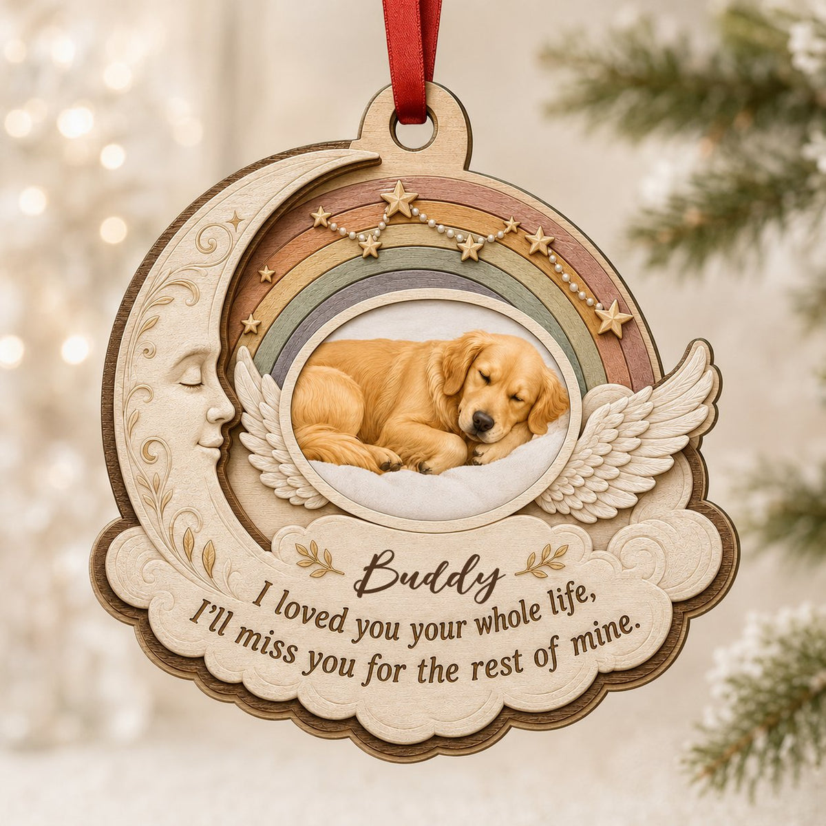Wood ornament with crescent moon, angel wings, rainbow, and a sleeping dog photo above a cloud plaque.