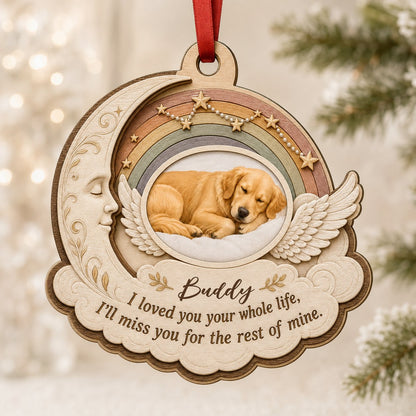 Wood ornament with crescent moon, angel wings, rainbow, and a sleeping dog photo above a cloud plaque.