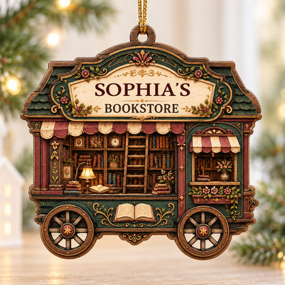 Custom-cut wood ornament shaped like a vintage bookstore wagon with books, ladder, and striped awnings.