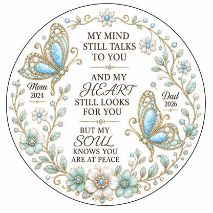 White round ornament with jeweled butterflies, floral wreath, and memorial quote with personalized name and year.