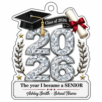 Custom-cut clear acrylic ornament shaped like a graduation cap with Class of 2026, diploma, laurels, and name plaque.