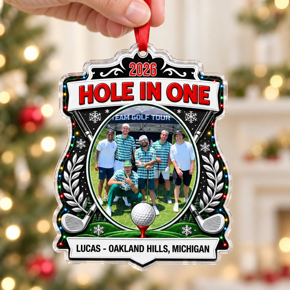Acrylic crest ornament with golf photo, crossed clubs, Christmas lights, snowflakes, and HOLE IN ONE 2026 text.