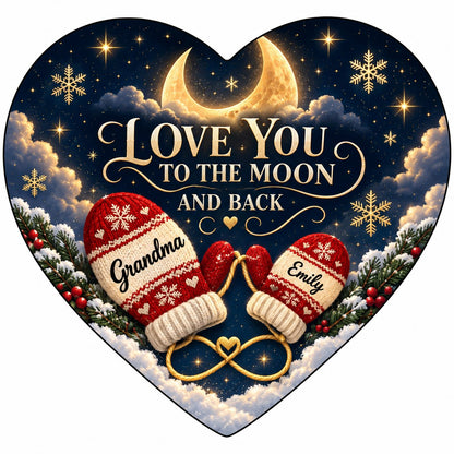 Heart ceramic ornament with golden crescent moon, red mittens, snowflakes and pine, personalized with two names.