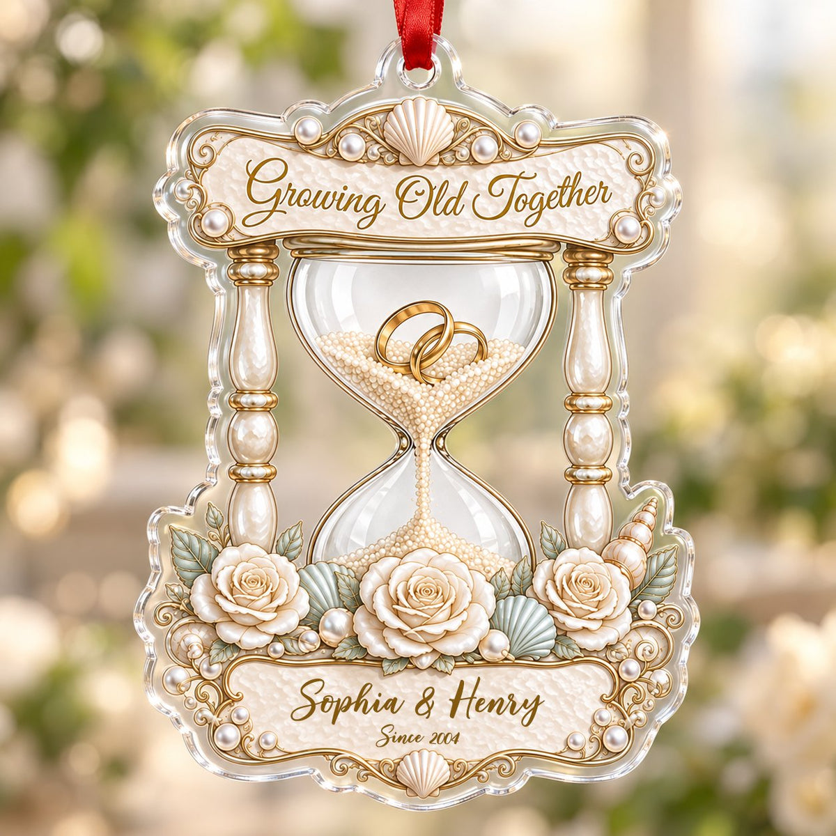Acrylic hourglass ornament with gold rings, roses, seashells, pearls, and Growing Old Together text.