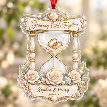 Acrylic hourglass ornament with gold rings, roses, seashells, pearls, and Growing Old Together text.