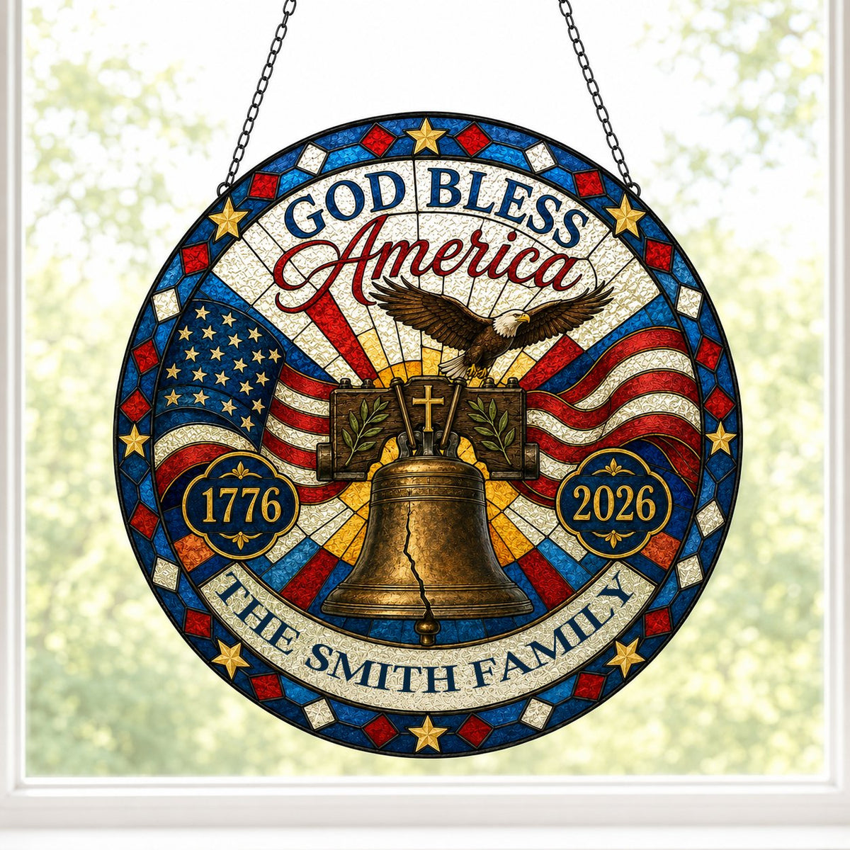 Round stained-glass style suncatcher with Liberty Bell, eagle, flags, 'GOD BLESS America' 1776–2026 and a family name