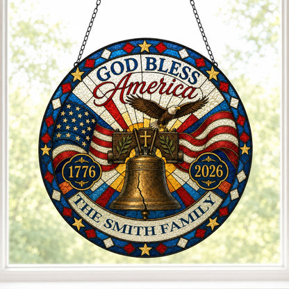 Round stained-glass style suncatcher with Liberty Bell, eagle, flags, 'GOD BLESS America' 1776–2026 and a family name