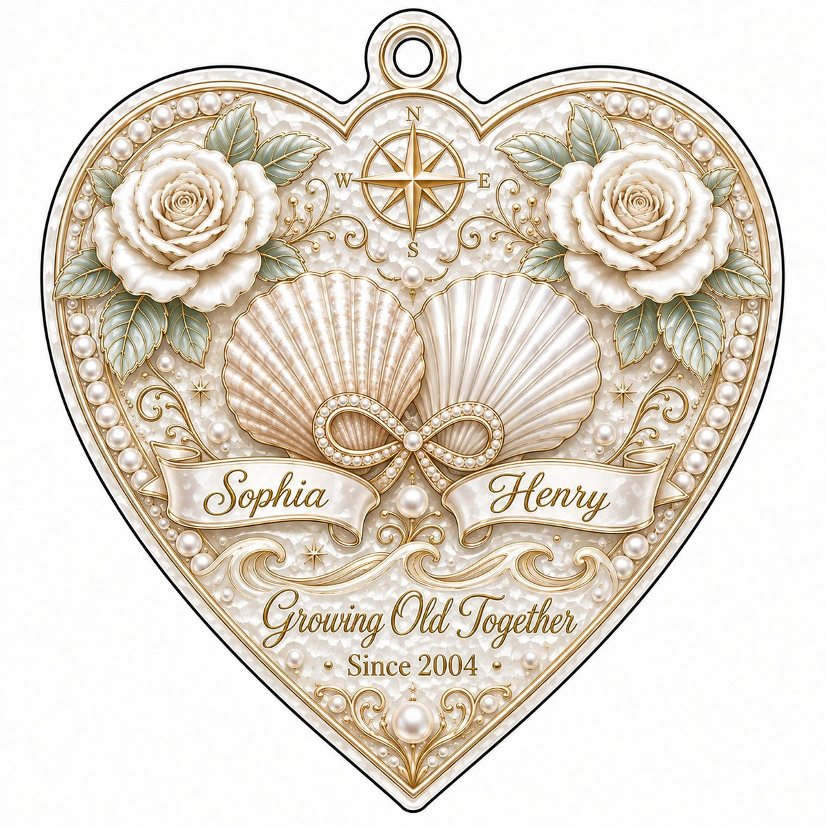 Heart-shaped clear acrylic ornament with seashells, pearl infinity symbol, compass star, and two name ribbons.