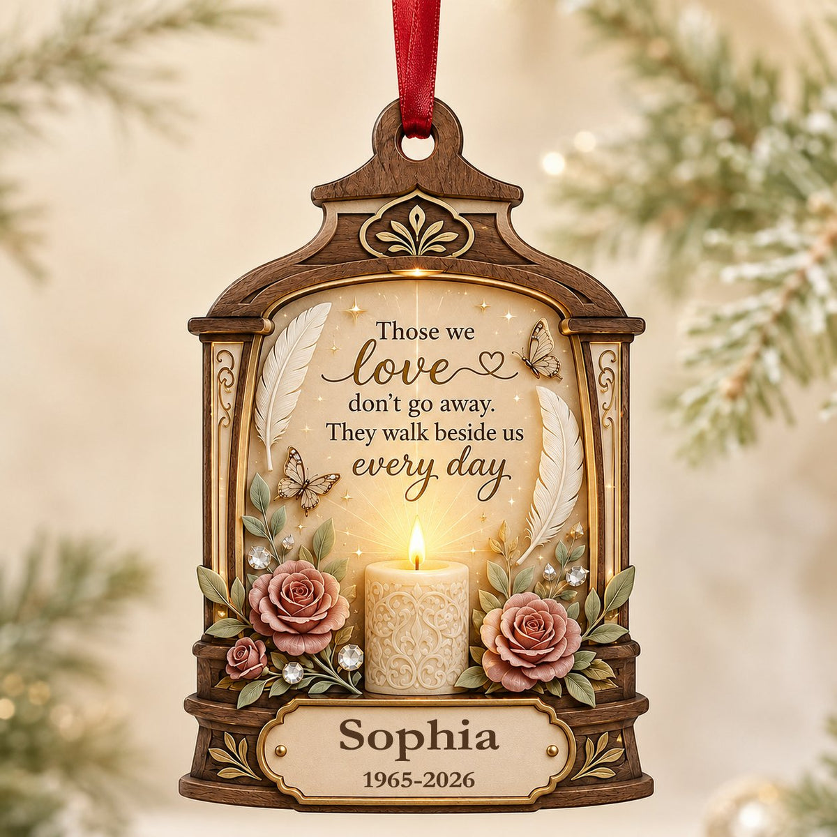 Arched wood-look ornament with lit white candle, two pink roses, butterflies, feathers, and a memorial quote.