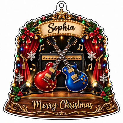 Custom-cut acrylic ornament with crossed red and blue guitars, Merry Christmas marquee, curtains and holly.