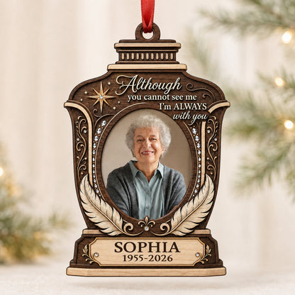 Lantern-shaped memorial wood ornament with oval photo, two feathers, starburst, fleur-de-lis and scrollwork accents.