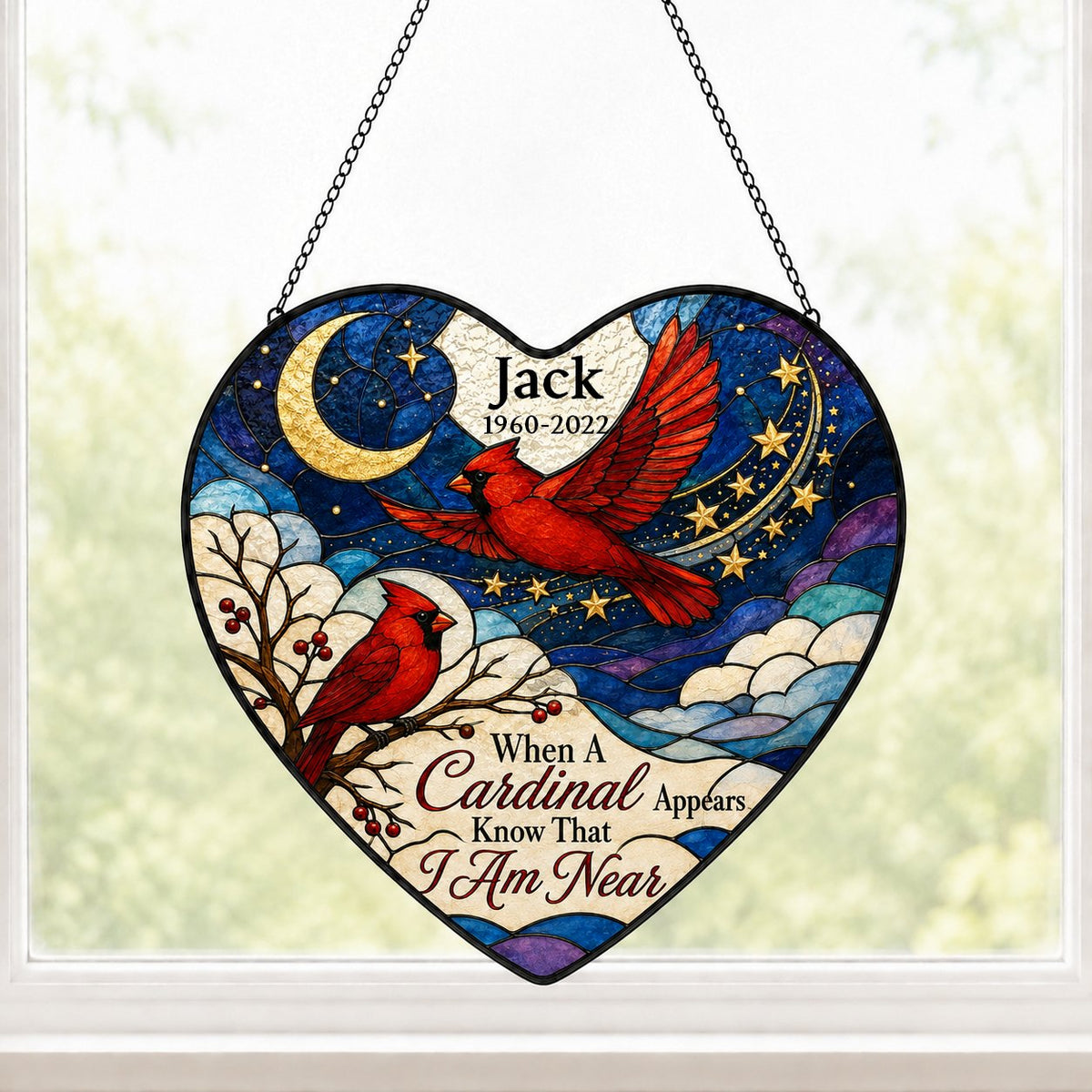 Heart stained-glass suncatcher with two red cardinals, a crescent moon, stars, and a branch with red berries.