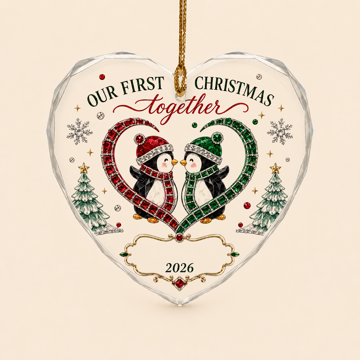 Heart-shaped stained glass suncatcher with two penguins in red and green scarves, jeweled trees, and silver snowflakes